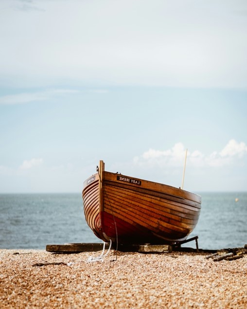 A beautiful, yet simple, wooden boat on the beach